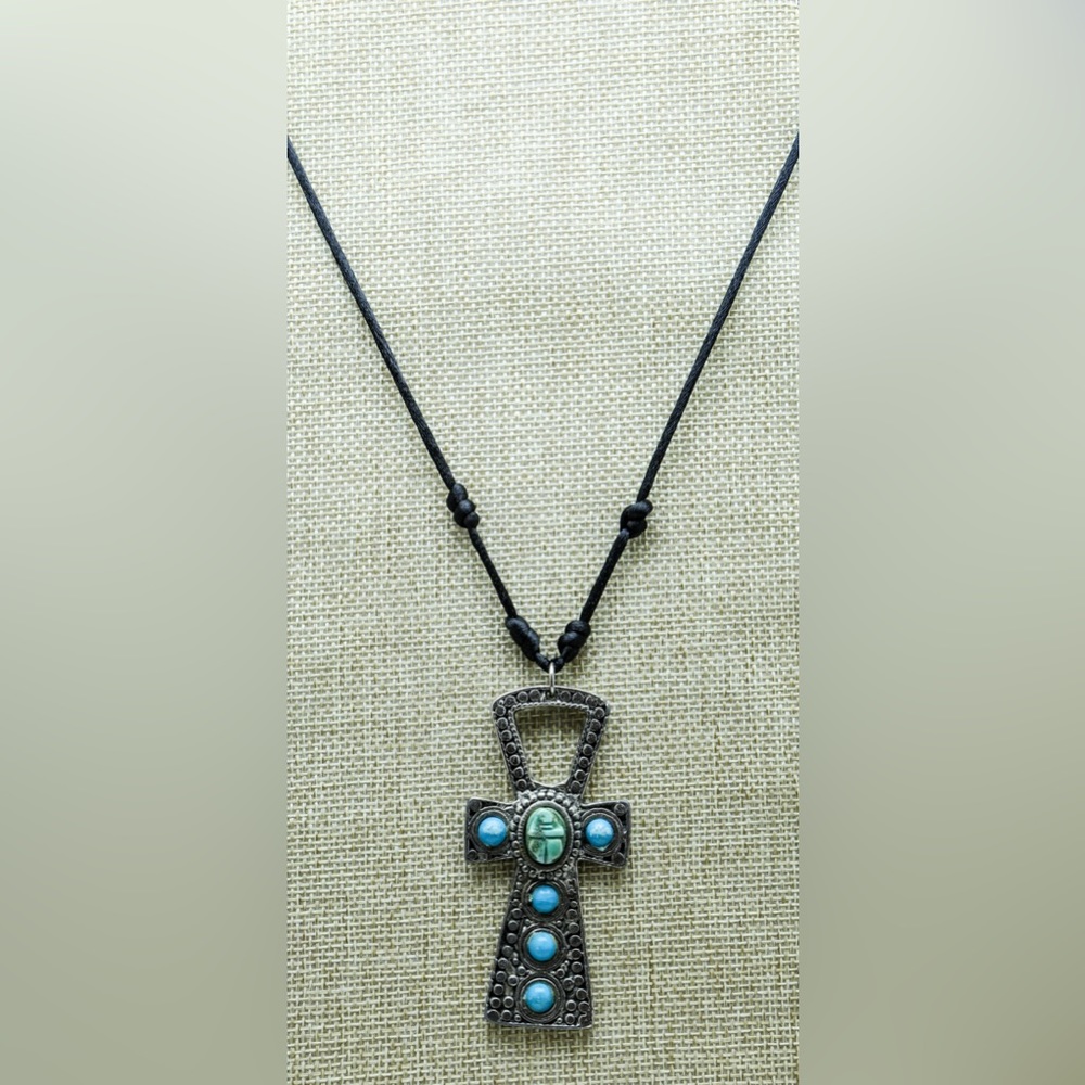 Large metal Ankh with a blue stone scarab and blue stone embellishments.